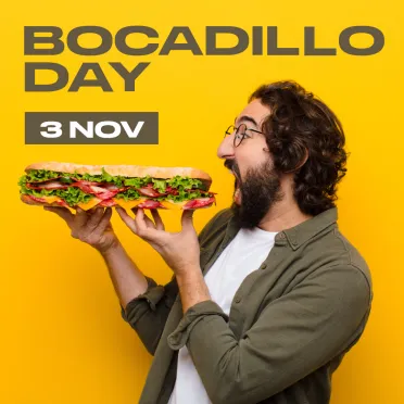 Chico con gafas comiendo bocadillo